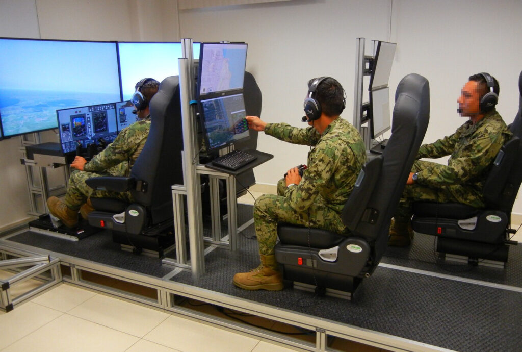 Multi-station mission training console with crew operating tactical and map displays